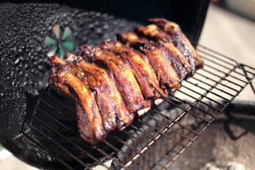 Dry rub beef ribs on the BBQ grill.