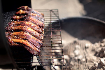 Dry rub beef ribs on the BBQ grill.