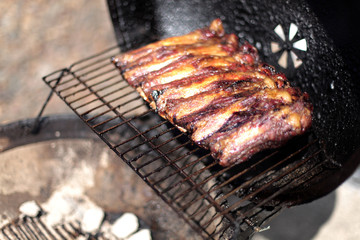 Dry rub beef ribs on the BBQ grill.