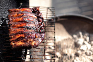 Dry rub beef ribs on the BBQ grill.