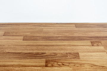 Laminated wood floor with white wall
