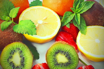 Fototapeta na wymiar citrus fruits and strawberries on white background