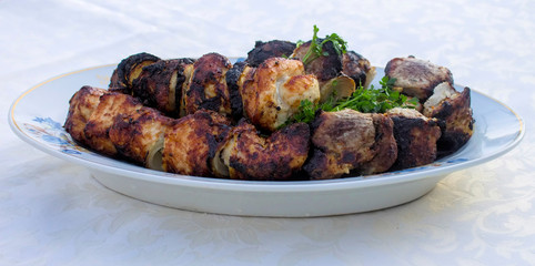 Fried shish kebab on a plate.