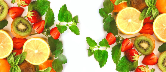 citrus fruits and strawberries on white background