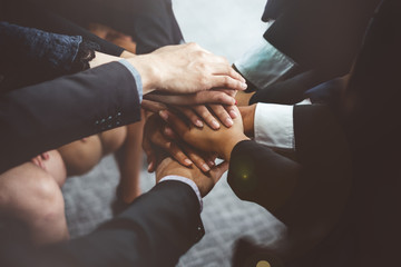 Business diversity people stacking hands for teamwork concept