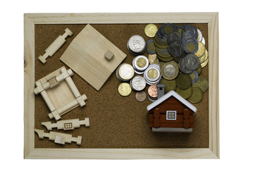 Mortgage loan and real estate tax macro financial Concept, Scandinavian house model and pile of coins money on brown wooden frame, with copy space.