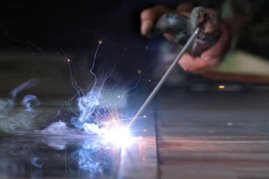 The Reaction Of Welding Wire And Metal With Smoke Fire And Sparkle Light