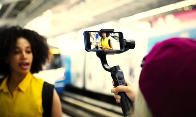 Young woman traveling and vlogging