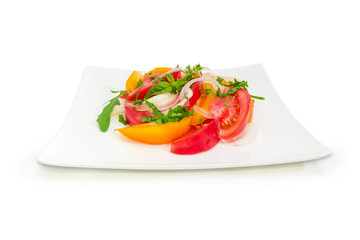 Salad of the red and yellow tomatoes and onion