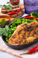 Fried chicken breast with green vegetables