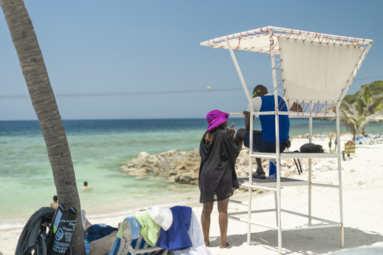 Woman talking to a lifeguard in Haiti