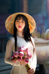 Vietnam woman wearing Ao Dai culture traditional at old temple at Ho Chi Minh in Vietnam,vintage style,travel and relaxing concept. - 212537262