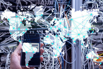 Internet and telecommunication concept with world map on server room background.