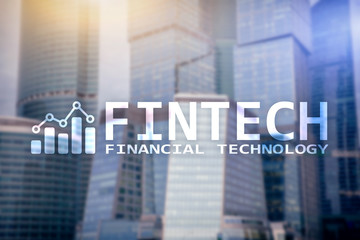 FINTECH - Financial technology, global business and information Internet communication technology. Skyscrapers background. Hi-tech business concept.