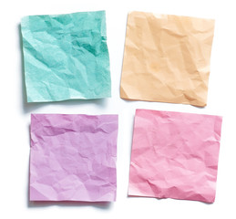 Obraz premium Four colored crumpled sticky note reminders
