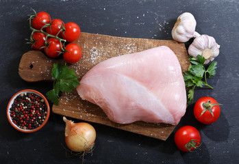 fresh turkey meat with ingredients for cooking