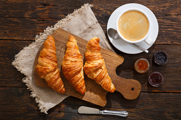 breakfast with fresh croissants and cup of coffee