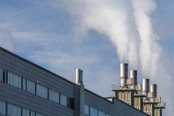 Iindustrial building with smoking chimneys