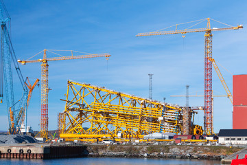 Fototapeta na wymiar Industrial landscape with cranes. Norway