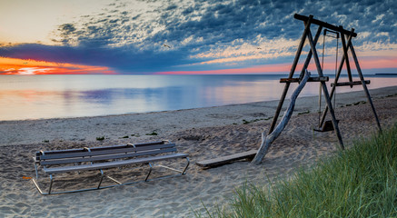 Coastal landscape at colorful dawn, touristy spot,  sandy beach of the Baltic Sea