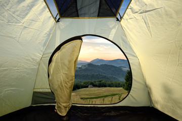 View from inside a tent on mountains landscape
