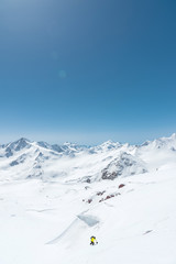 Fototapeta na wymiar Winter snow covered mountain peaks in Caucasus. Great place for winter sports