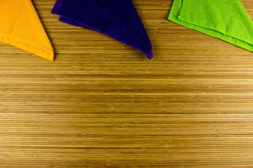 Color Napkin on a wooden table. Empty copy space for text and design