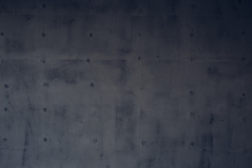 Dark gray rough surface of a concrete wall as a background texture