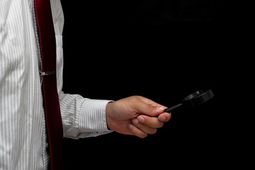 bussiness person has (hold) magnifying glass lens loupe