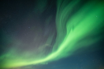 Beautiful Northern lights, Aurora borealis dancing on night sky © Mumemories