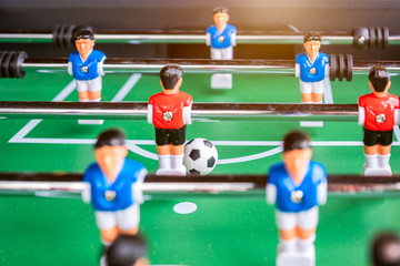 Close-up of Table football soccer game on green field