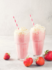 Strawberry milkshake or smoothie and fresh raw berries