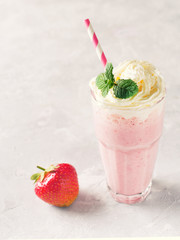 Strawberry milkshake or smoothie and fresh raw berries