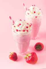 Strawberry milkshake or smoothie and fresh raw berries