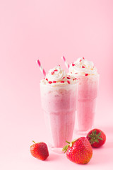 Strawberry milkshake or smoothie and fresh raw berries