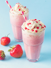 Strawberry milkshake or smoothie and fresh raw berries