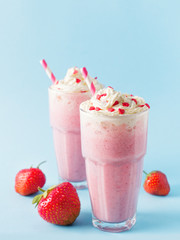 Strawberry milkshake or smoothie and fresh raw berries