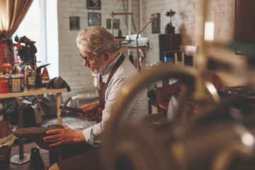An elderly master in studio