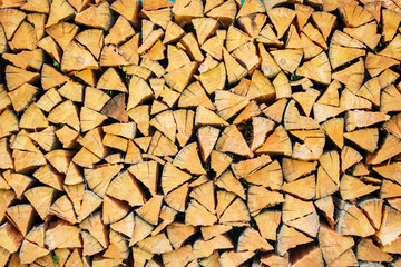 Stack of dry chopped firewood. Texture