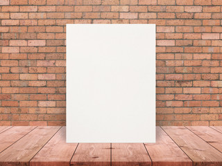 Blank Eco textured paper poster on wood table top at old brick wall,Template mock up for adding your design.