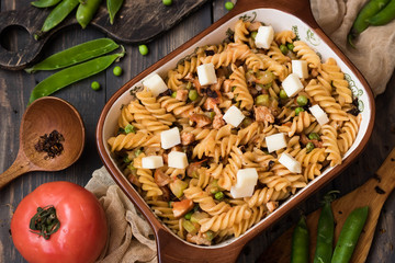 Fusilli pasta with zucchini, goat cheese and green peas