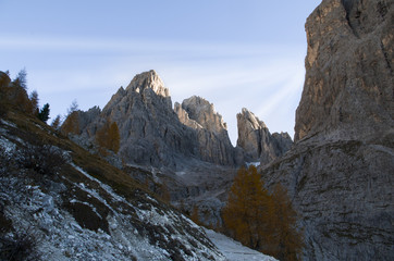 Beautiful sunrise with sun beams from behind the mountain