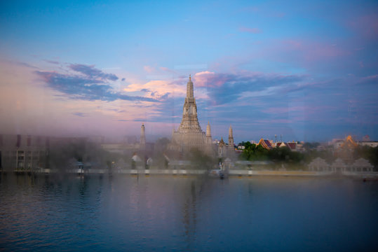 Wat Arun temple in Bangkok from stream window