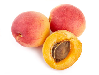 Isolated apricots. Fresh apricot fruit isolated on white background. Tropical abstract background. Fresh fruits. Place for your text.
