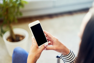 Smartphone mockup. Woman using phone at home