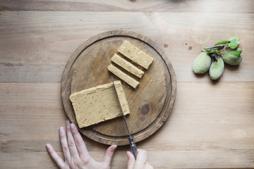 Spanish almond nougat on wooden table (sweet christmas)