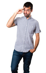Fototapeta premium Handsome man saluting on isolated white background