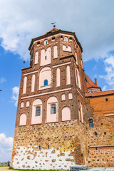 Mir, Belarus. Castle Complex Mir On Sunny Day with blue sky Background. Old medieval Towers and walls of traditional fort from unesco world heritage list