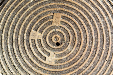 concentric round texture cast-iron hatch cover of brown rusty co