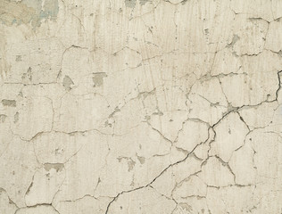 texture old concrete wall with remains of plaster with cracks